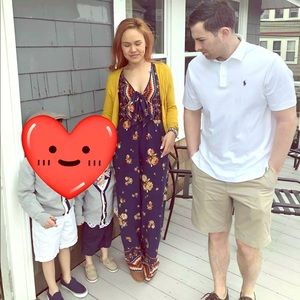 Navy blue floral jumpsuit with front bow detail